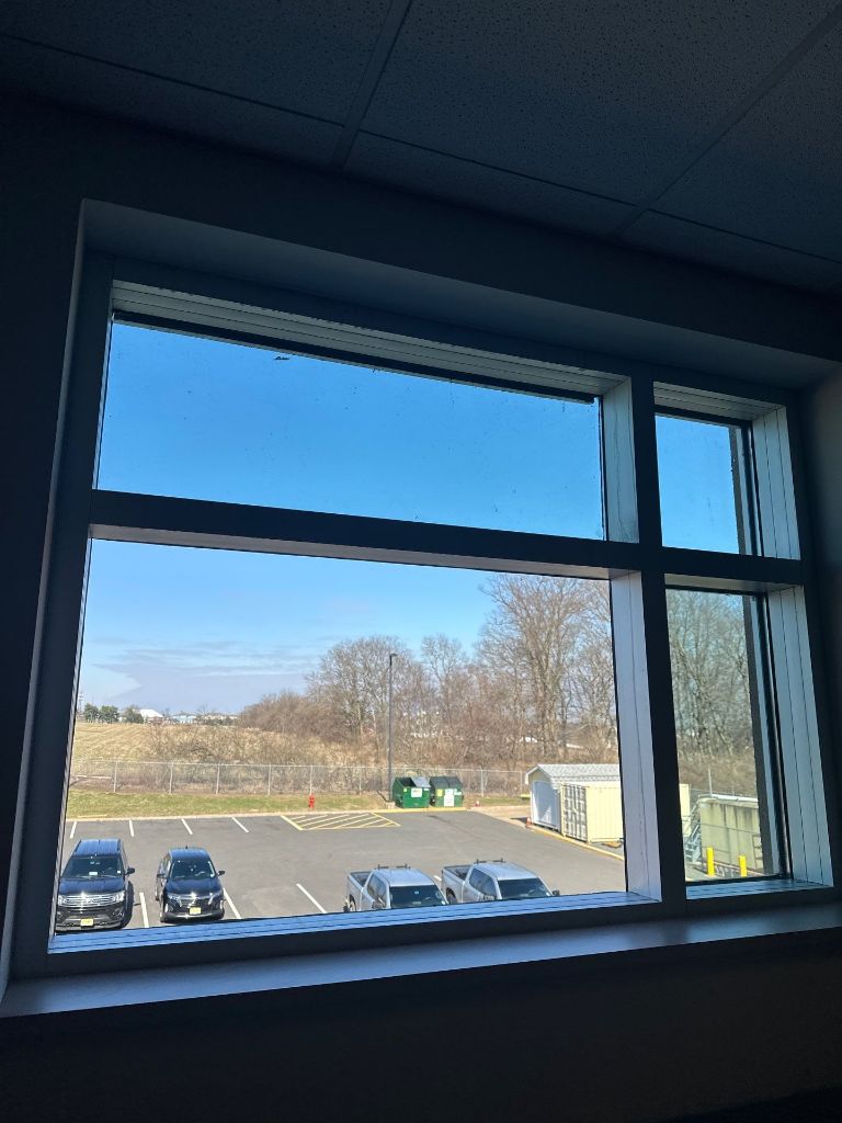 Cracked commercial window glass before repair