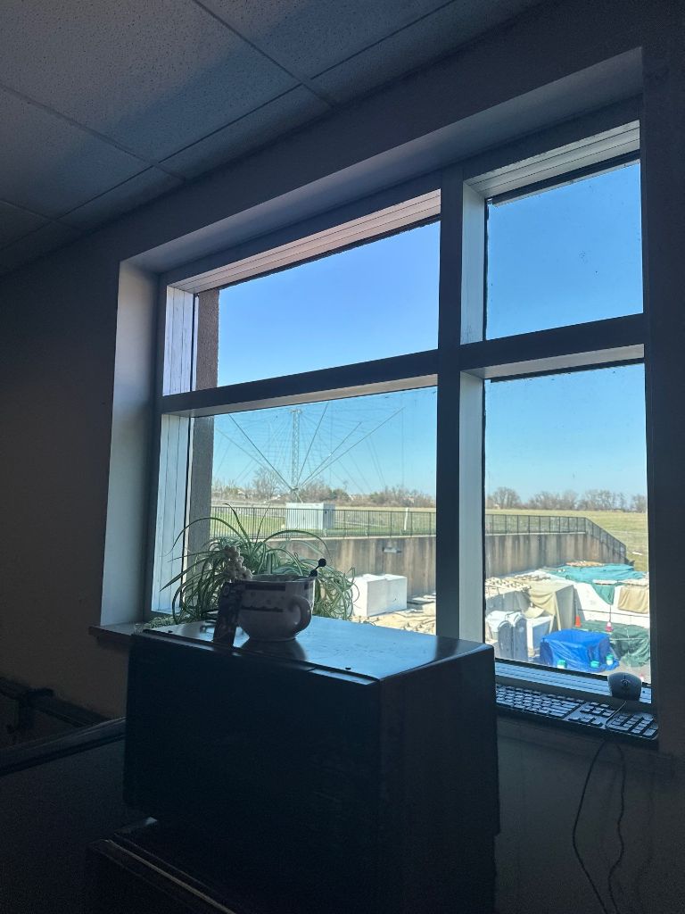 Commercial window glazing installation on multi-story building exterior