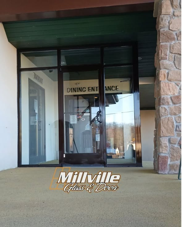 Commercial dining entrance with glass doors and storefront framing